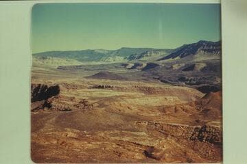 Looking up Queantoweap Valley also known as Hurricane Ledge Valley. Upper left is Mt. Trumbull and upper center is Mt. Logan. The peaks of Mt. Emma can be seen above the cliffs upper right