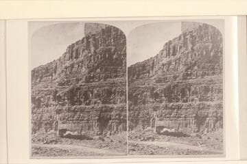 View of the Wall (See men and boats on bank of river). The rapid is Dark Canyon Rapid