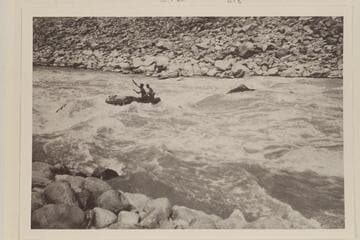 Southwest Exploration party in Cataract Canyon. In the boat are Ken Ross and Jon Lindbergh. "In No. 23"