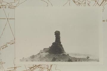 Chimney Rock. Elevation at top is 5697 ft. In lower Moencopie Formation. Note white horse at the foot. The Rock also carries the confusing name, Candlestick Spire