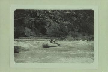 Mildred Davis pulls out below No Name or Harp Rapid; Canyon of Lodore. Fern Davis rides as passenger. Photo from left bank