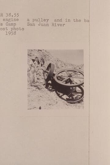 The gas engine, a pulley and in the background- the rock crusher. Spencer's Camp, San Juan River
