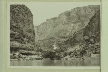 The pile of drift on top of the boulder at Boulder Narrows burning after ignition by the 1940 Nevills party. Lees Ferry gauge: 2m600 cfs