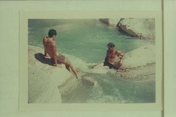 Swimming through a chute in Supai Creek. Garth Marston is at left, Bruce Wilson is swimming underwater and Norm Nevills is at right