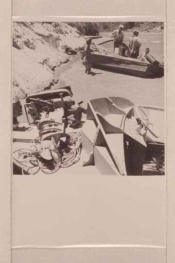 Wrecked motor in foreground, "Rattlesnake" in background.  Repairs after capsize in Vulcan Rapid- Masland, Desloge and Atherton, approximately Mile 184 on the left bank