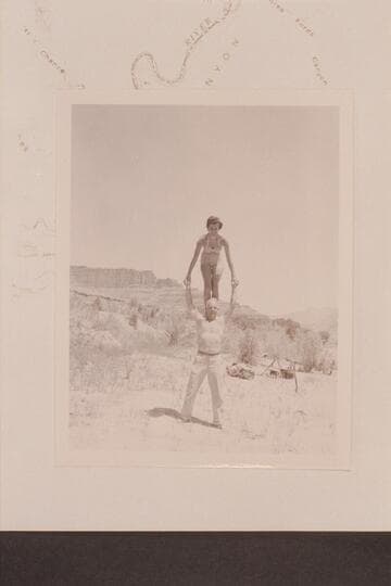 Maradel Marston and Moulty Fulmer put on the act. Camp at Mile 35 1/2 right bank at mough of Three Fords Canyon. The background shows the upriver formations
