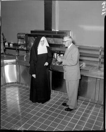Nun and man in Saint Francis Hospital cafeteria