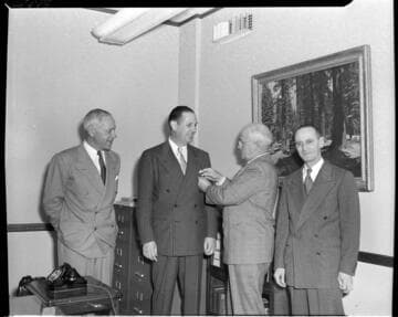 Four men in suits