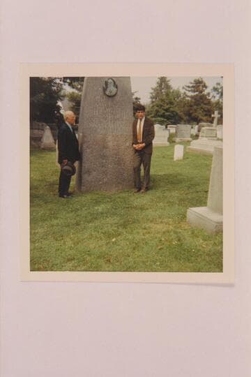 Dock Marston and Nate Marston at the grave of Powell. Arlington Cemetery
