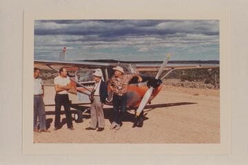 Charter plane at Navajo Mountain Trading Post strip: the pilot, Ralph Cameron, Dock Marston and Bill Belknap