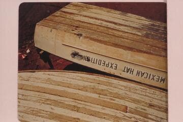 The "Mexican Hat Expedition" aluminum motor boat showing the battering imposed by some rocky navigation. The craft was in Wright's yard at Blanding