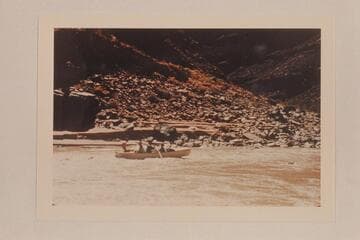 The Nevills San Juan punt with George Wing at the oars is freed from the rock near Johns Canyon. Mexican Hat gauge: 1190 cfs
