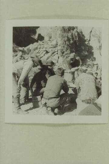 The cast of "The Colorado River Story" study action at a camp site opposite Kings Bottom below Moab. Disney crew. David Stollery; Ben Johnson; John Beal; Bob Armstrong; L. Q. Jones; Dan Sheridan; Brian Keith; Stan Jones is hidden except for his hat