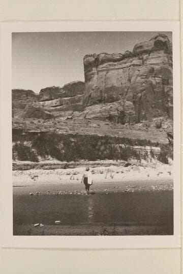 In Escalante Canyon returning from Gregory Bridge? Millie Baker carries the sack