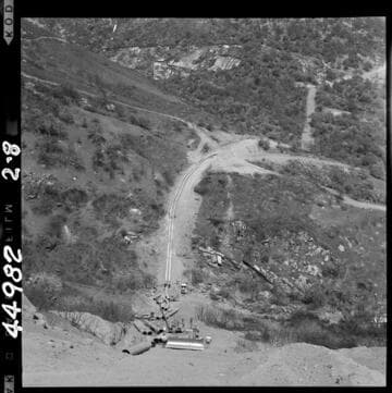 2-8 Tule Siphon - Progress photo. View from half way up outlet slope looking toward intake; distributing pipe along outlet slope